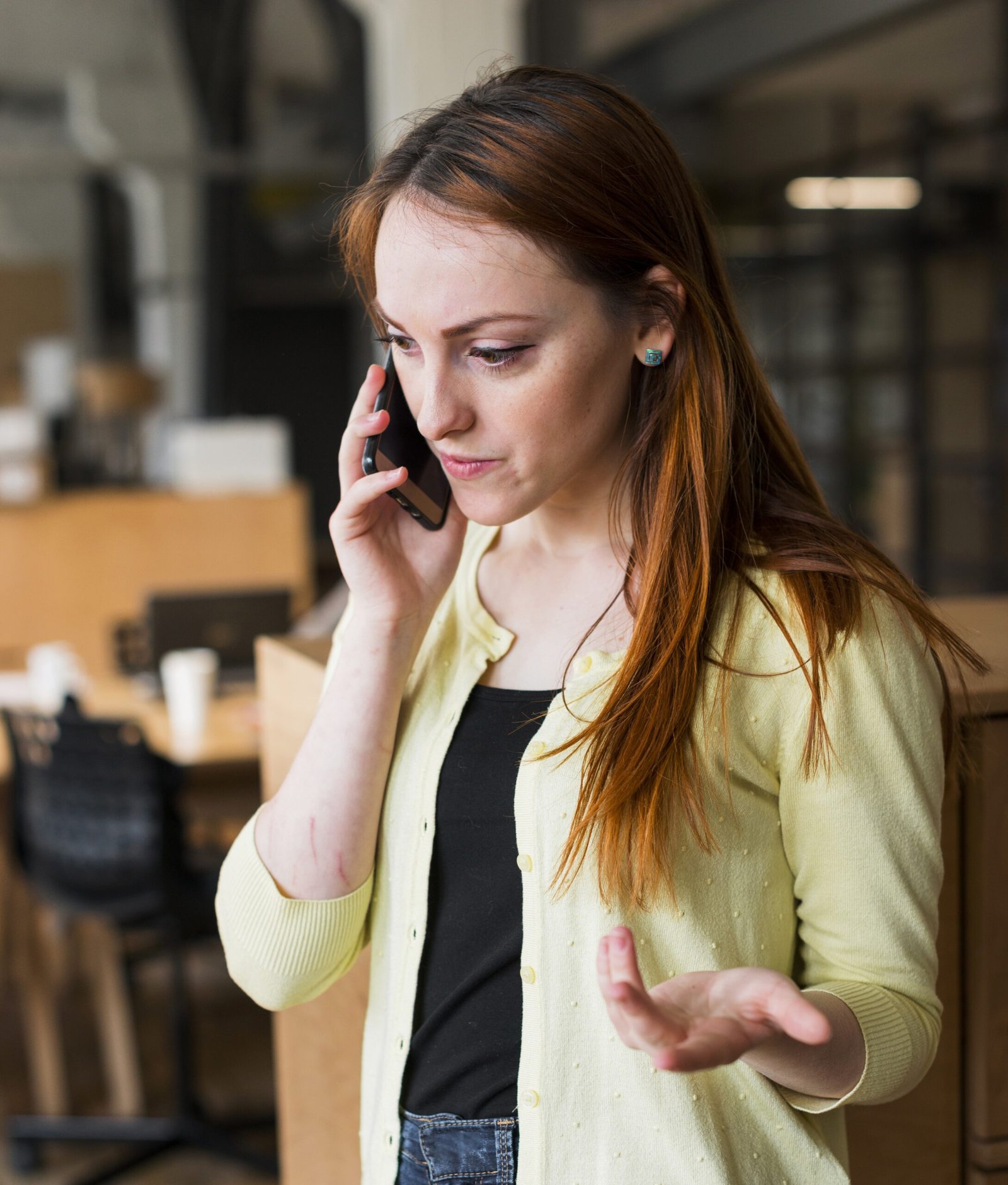beautiful-woman-gesturing-while-talking-cellphone